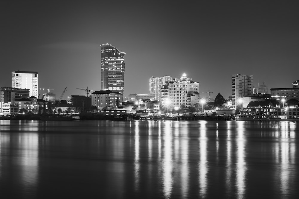 a black and white photo of a city at night