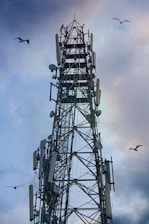 a tall tower with lots of antennas on top of it