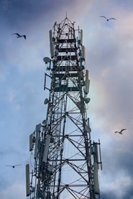 a tall tower with lots of antennas on top of it