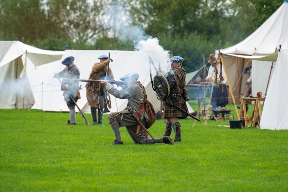 a group of men in period costumes playing a game of joust