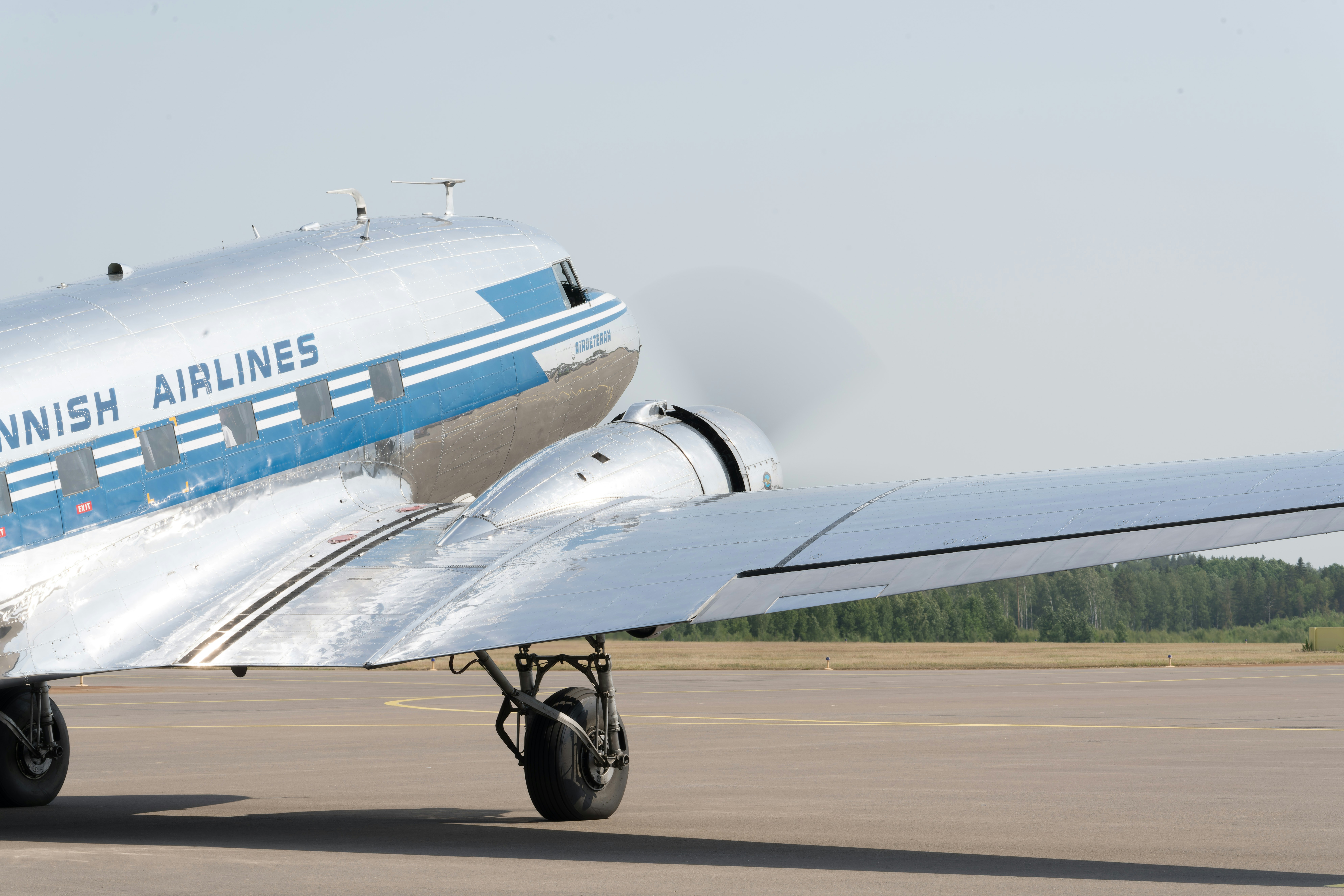 a small airplane sitting on top of an airport tarmac