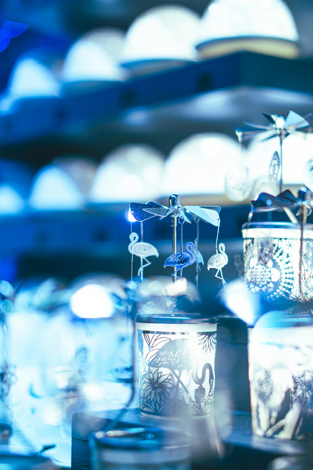 a group of glass containers sitting on top of a table