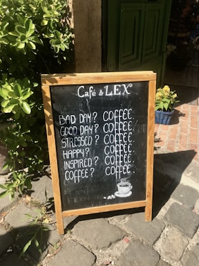 A cozy coffee stand with a chalkboard sign inviting customers to connect.