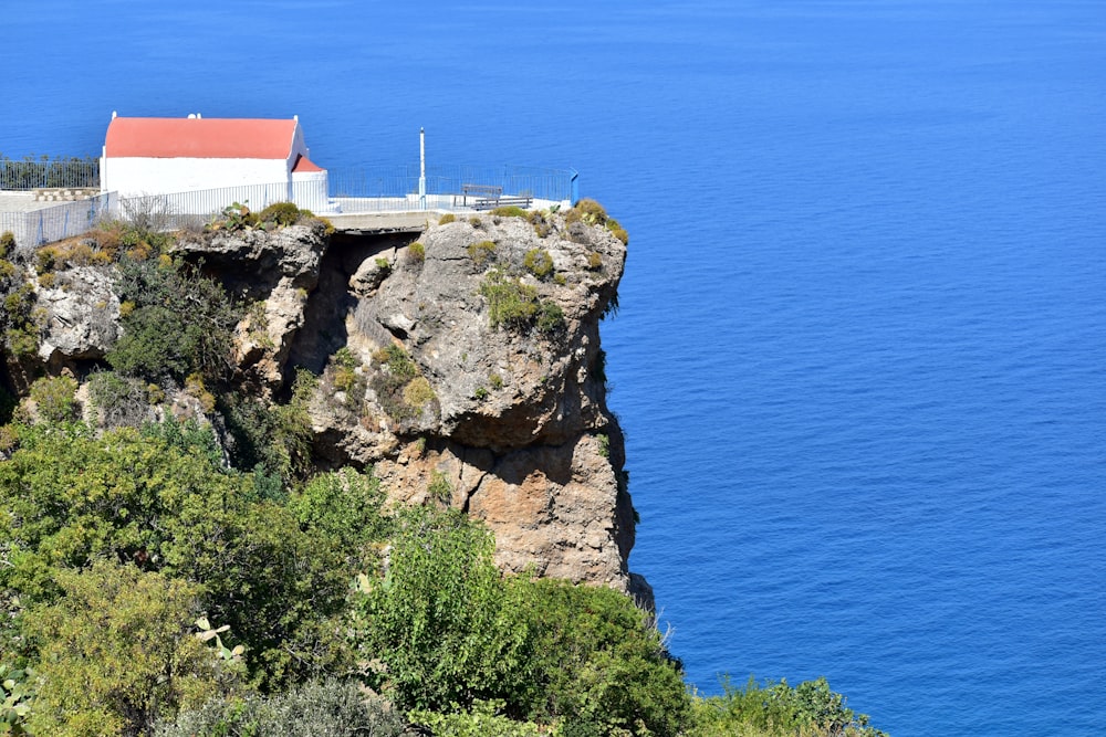 a house on a cliff overlooking the ocean