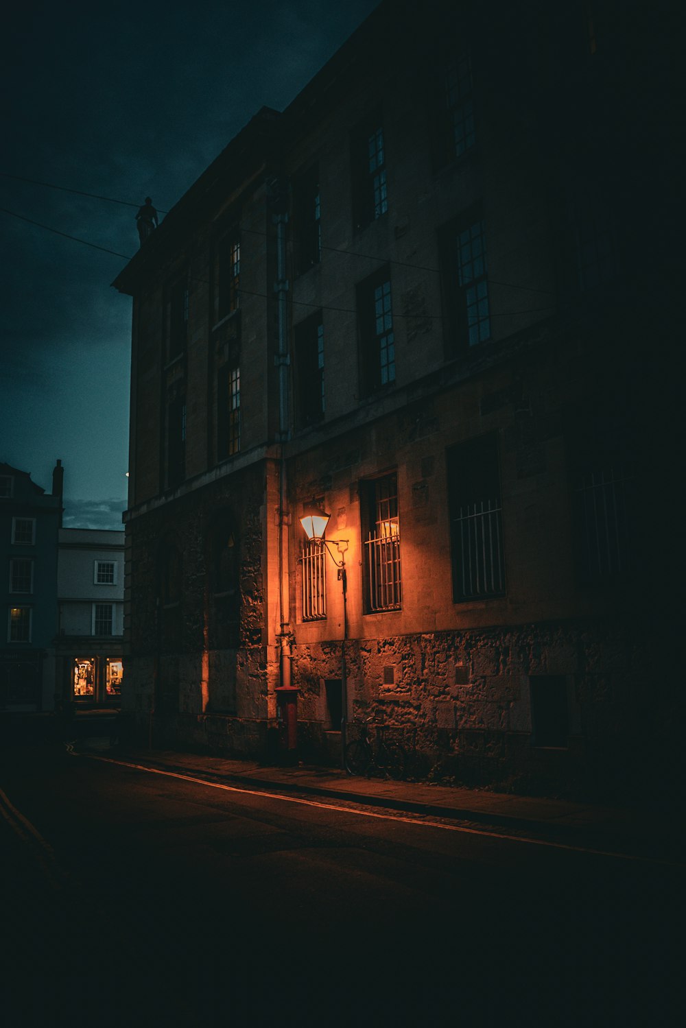 an old building with a street light in front of it