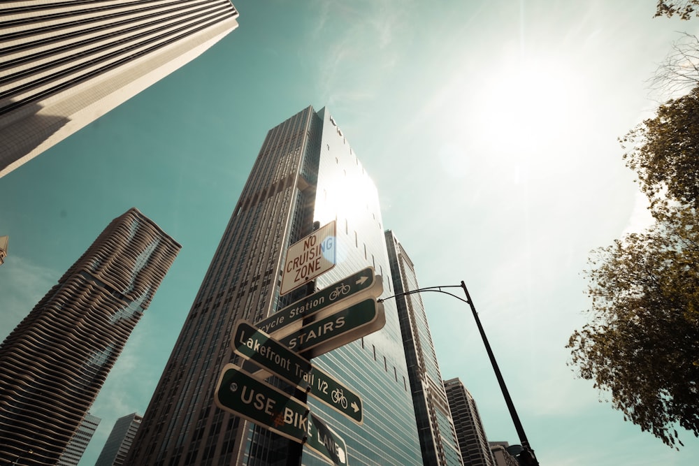 a street sign in front of a tall building