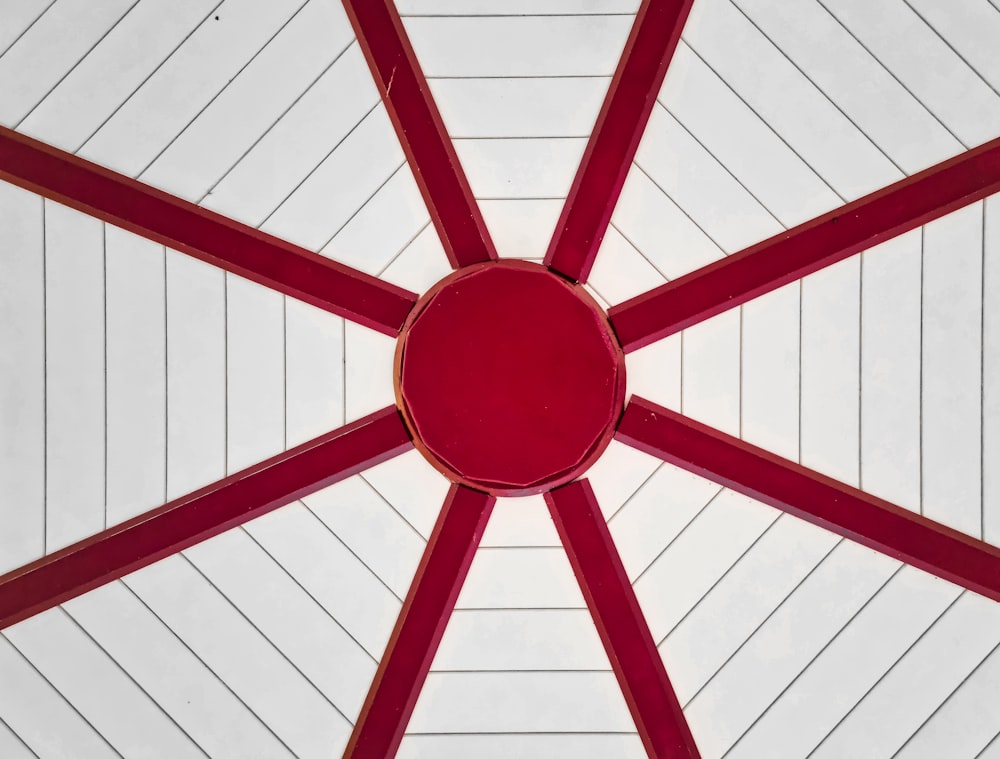 a close up of a red and white umbrella