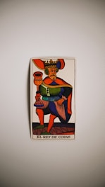 a picture of a king of cups on a wall