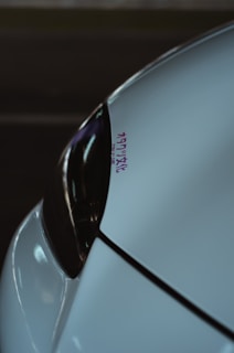 Close-up of a shiny, inspected used Japanese vehicle ready for export, with Be Forward Japan logo visible.