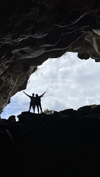 Cover art showing Zoe and Elliot facing a glowing cave entrance under a starry sky.