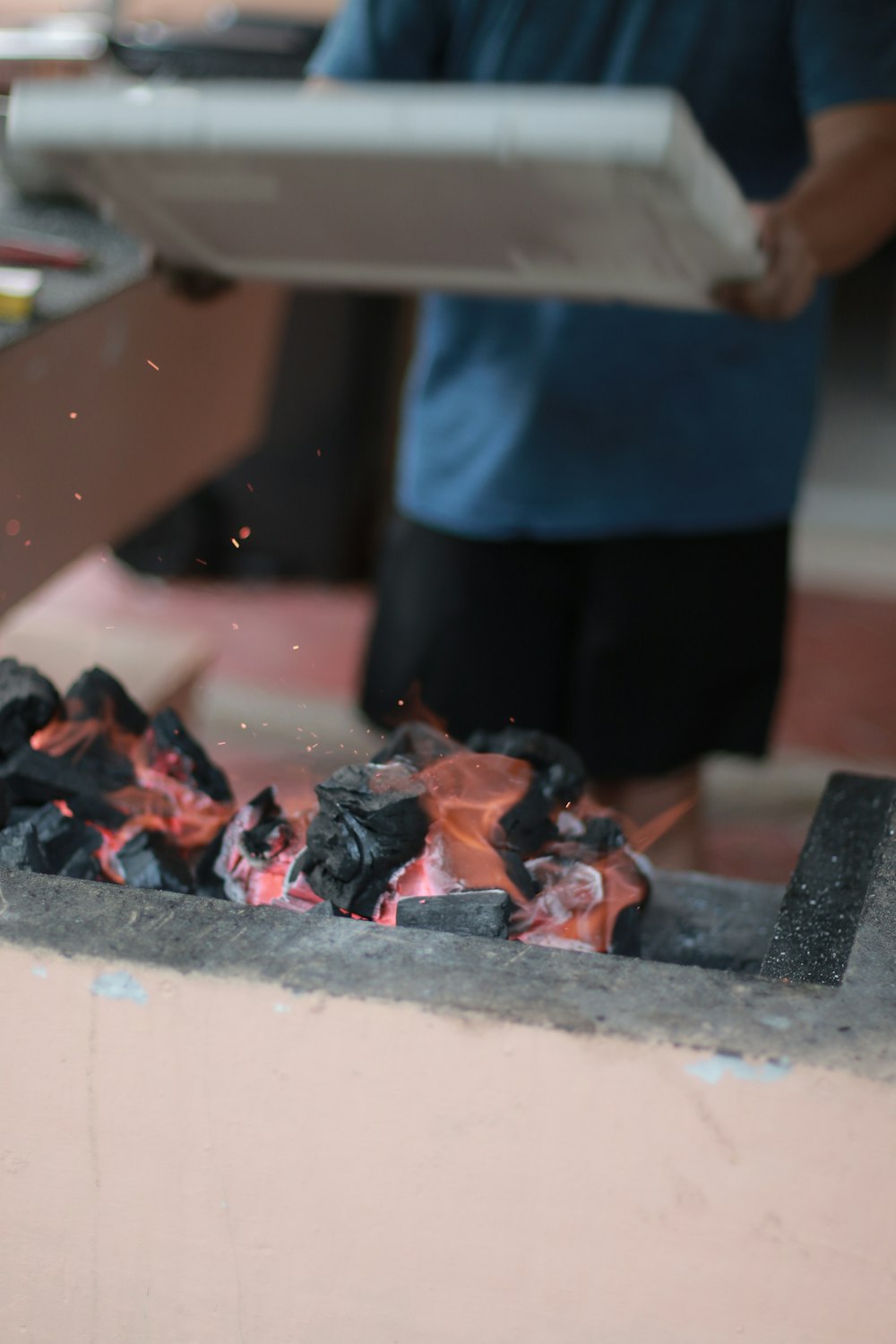 a man is cooking something on a grill