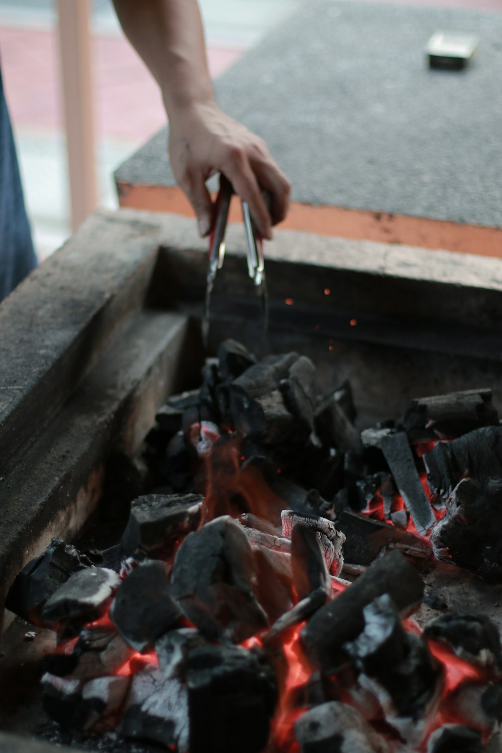 a person is cooking something on a grill