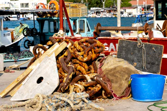 A close-up of marine tools and equipment neatly arranged on a wooden dock.