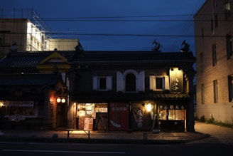 Facade of a restored historic Casabravo house blending traditional architecture with warm lighting at sunset.