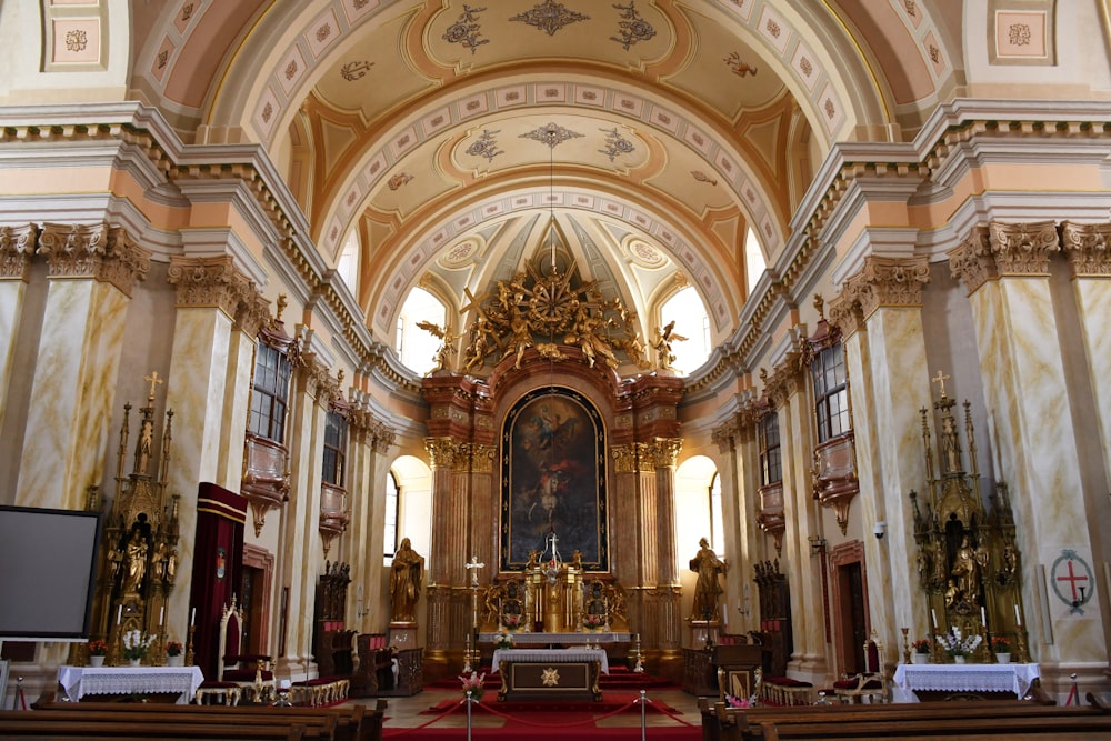 a church with a very high ceiling and a red carpet