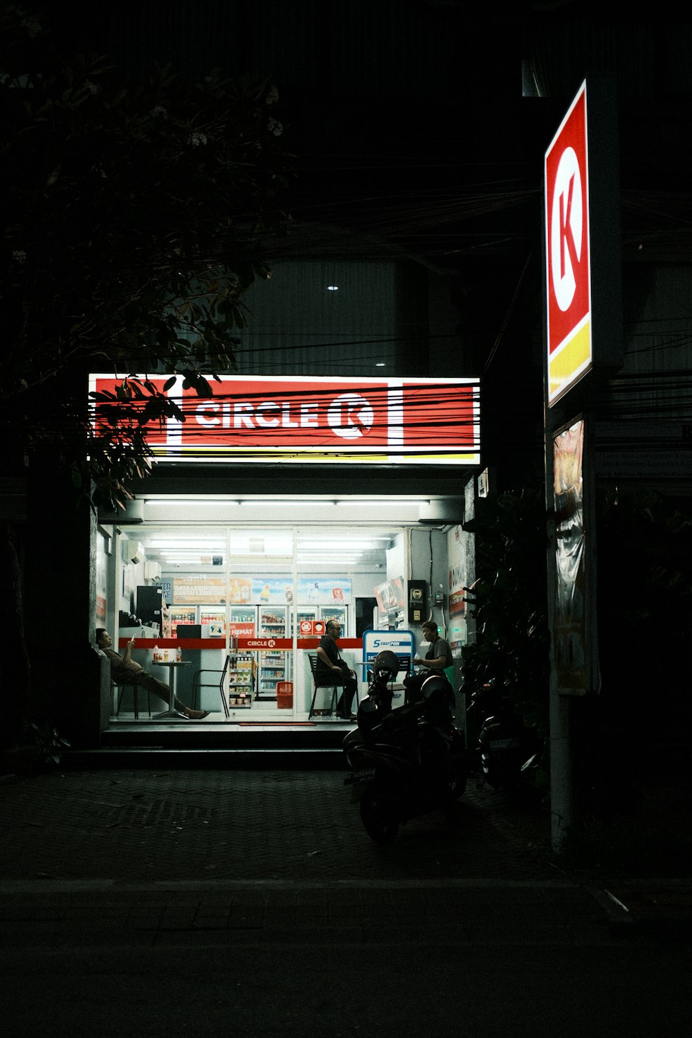 a motorcycle parked in front of a gas station