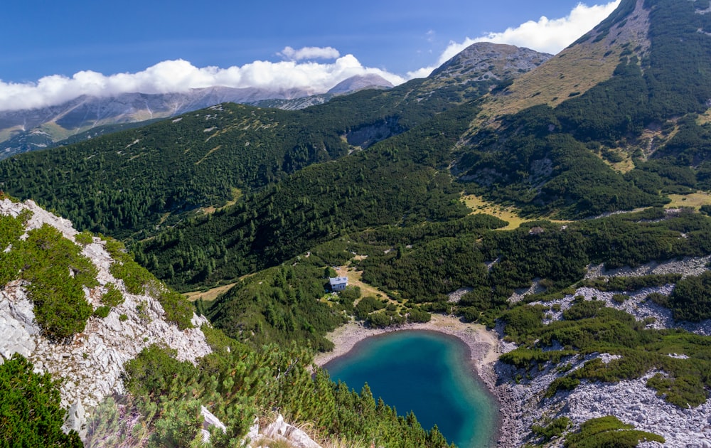 a view of a mountain with a lake in the middle of it