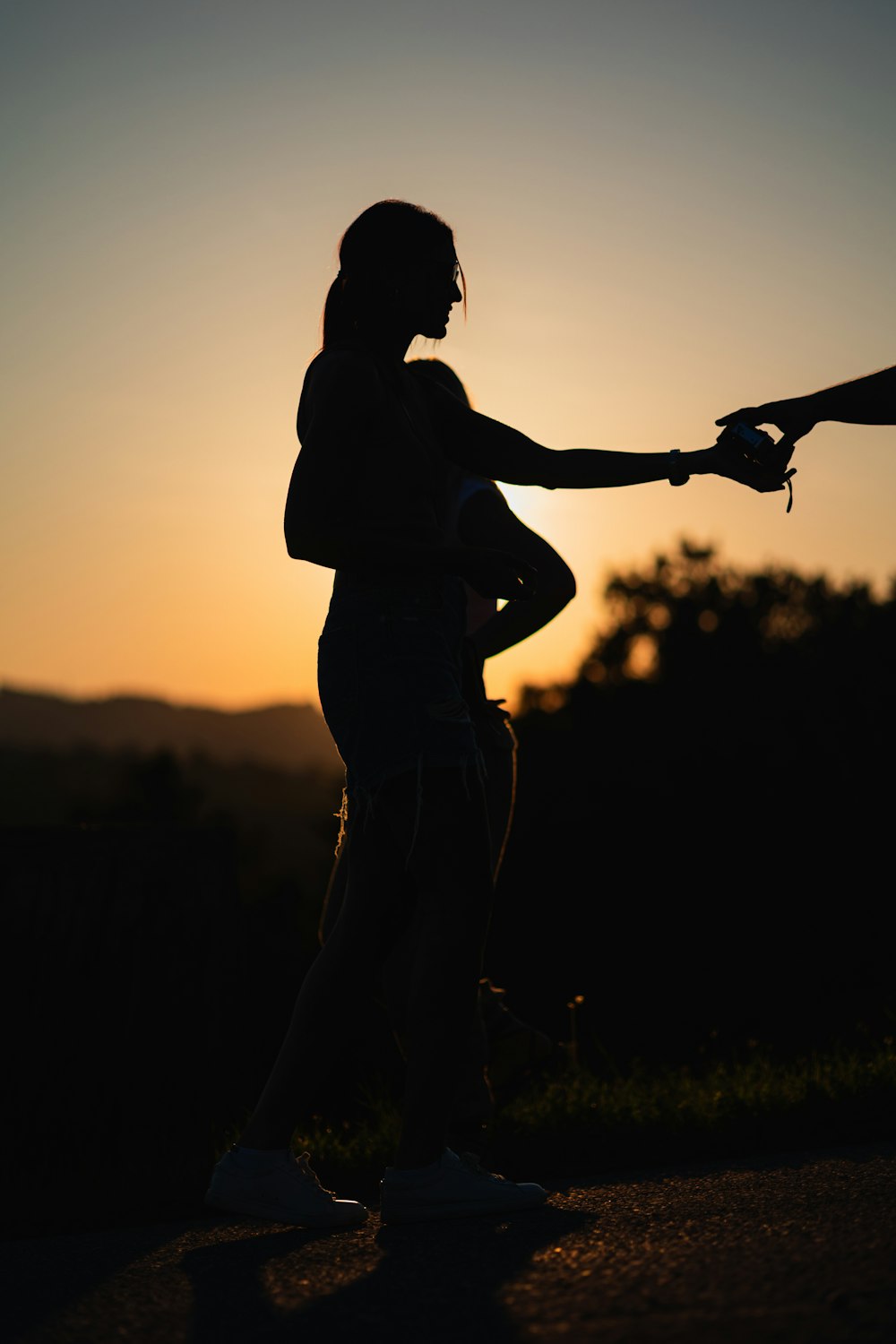 a woman holding a tennis racquet on top of a tennis court