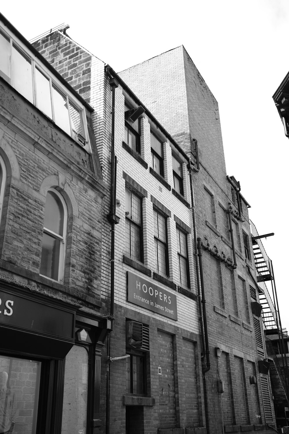 a black and white photo of a brick building