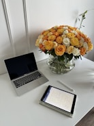 An organized workspace with documents and a tablet showing digital estate data