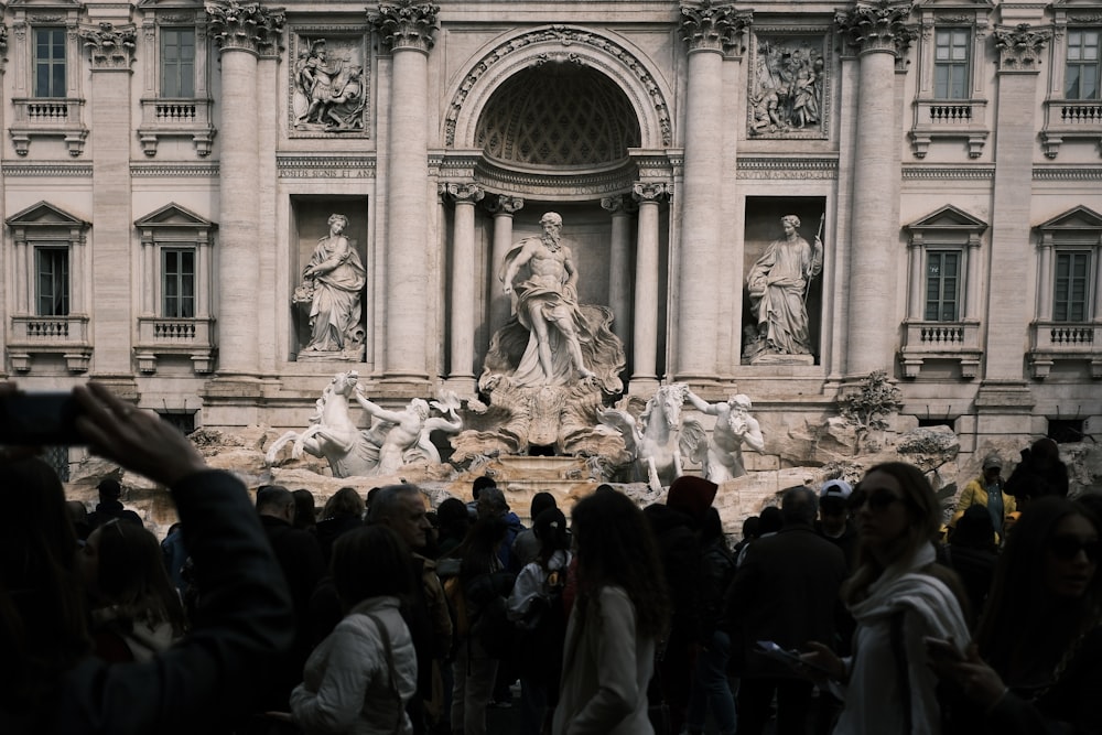 a crowd of people standing in front of a building