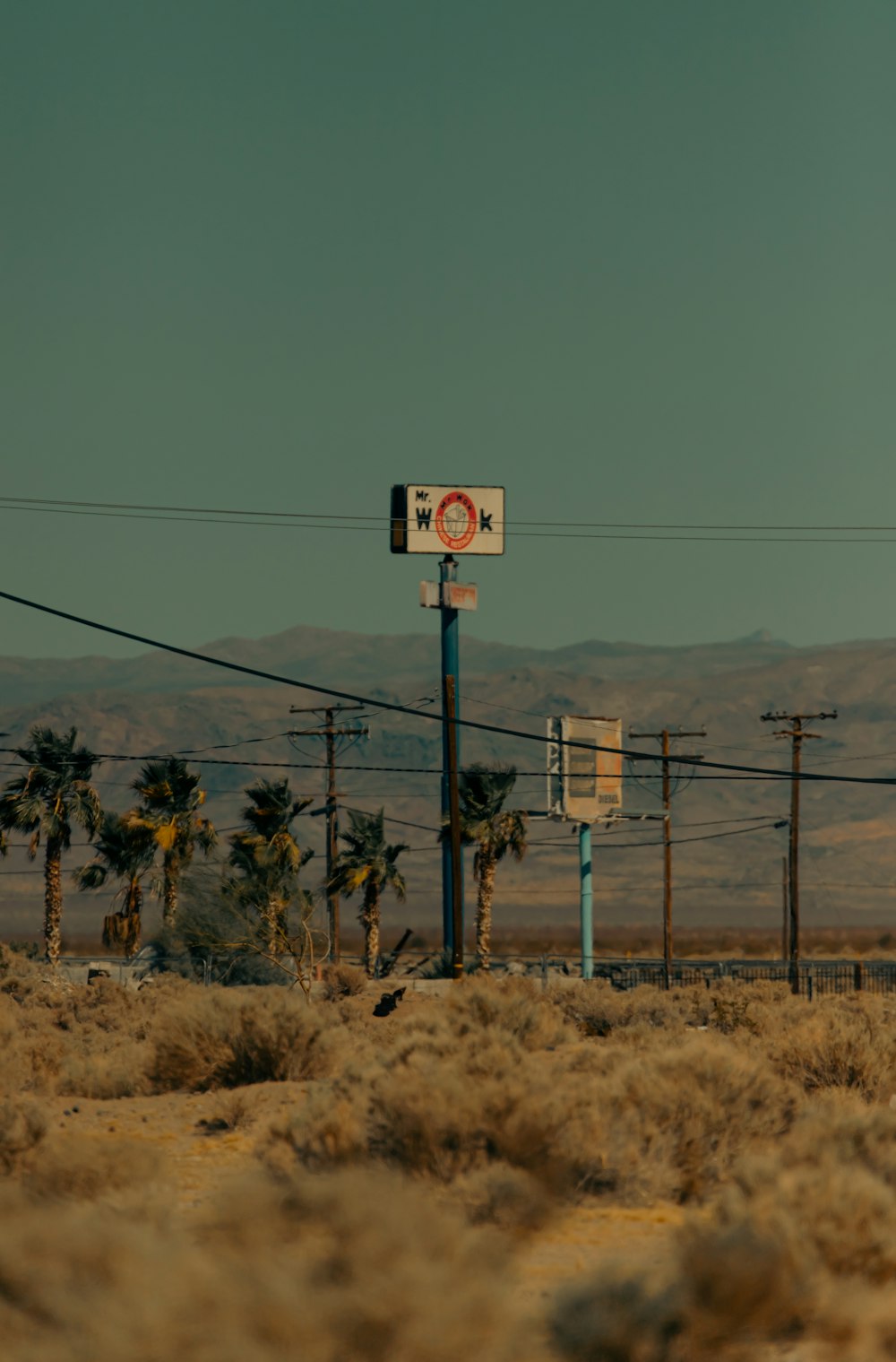 a street sign in the middle of a desert