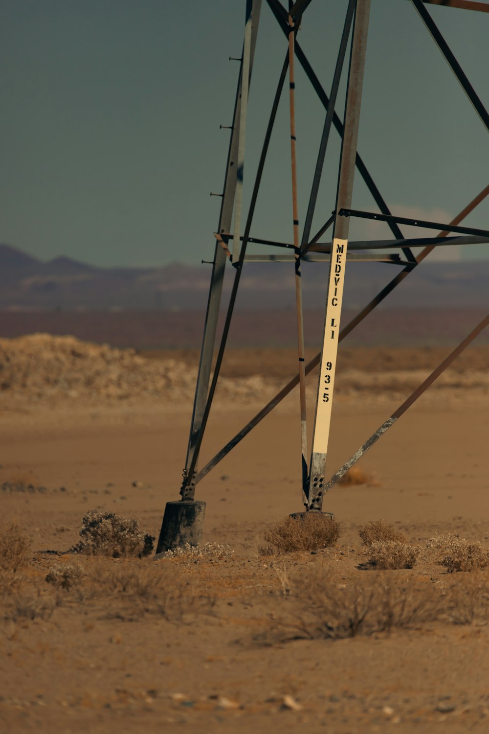 a power pole in the middle of a desert