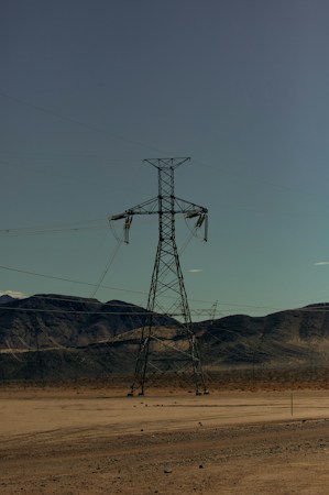 Transmission towers and power lines crossing the Southern Nevada desert, part of the power and ratepayer question in the data center debate