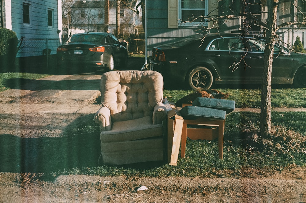 a chair and a table in a yard