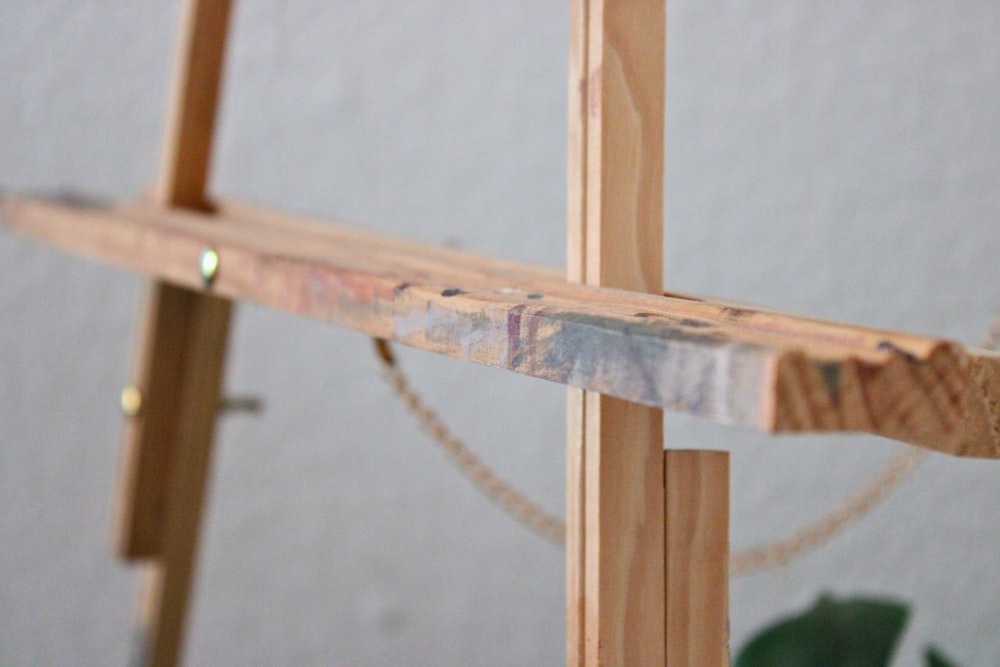 a close up of a piece of wood with a rope