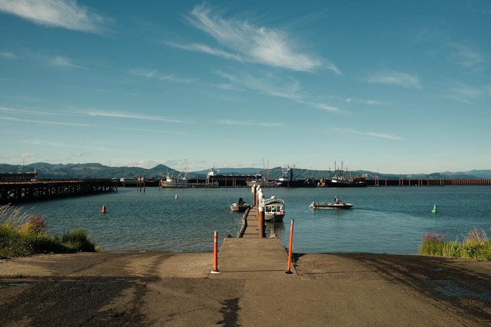 a boat is docked at a pier on a clear day