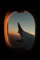 a view of the wing of an airplane through a window