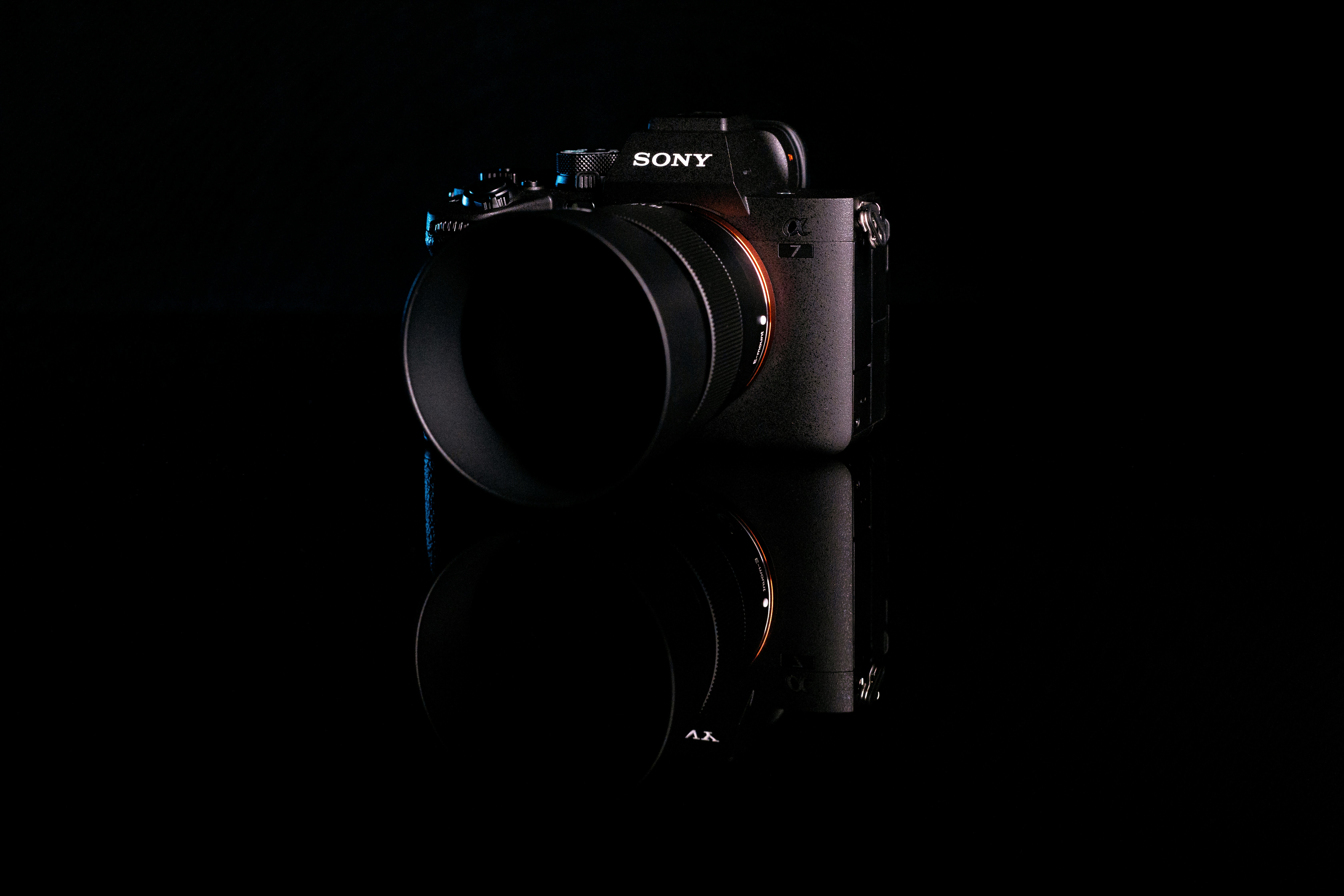 a black camera with a black background