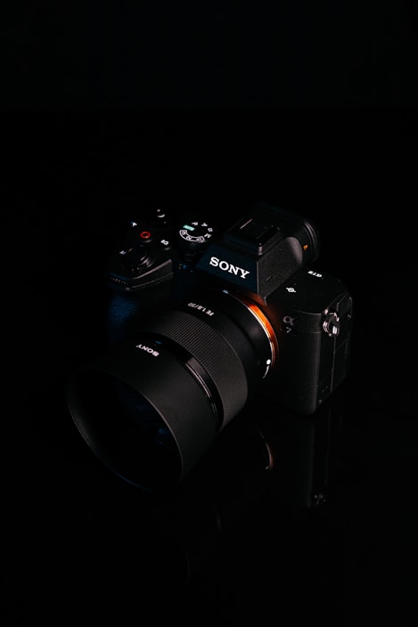 Modern digital camera with sleek design displayed against a clean white background.