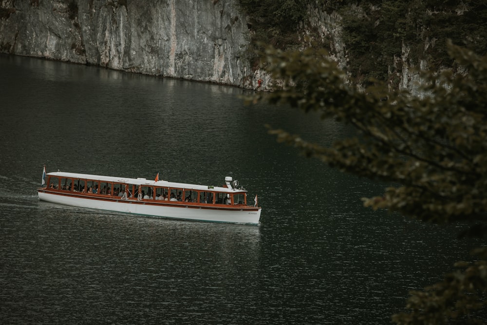 a boat with people on it in a body of water