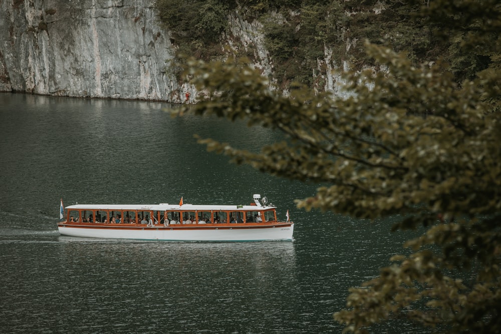 a boat with people on it in a body of water