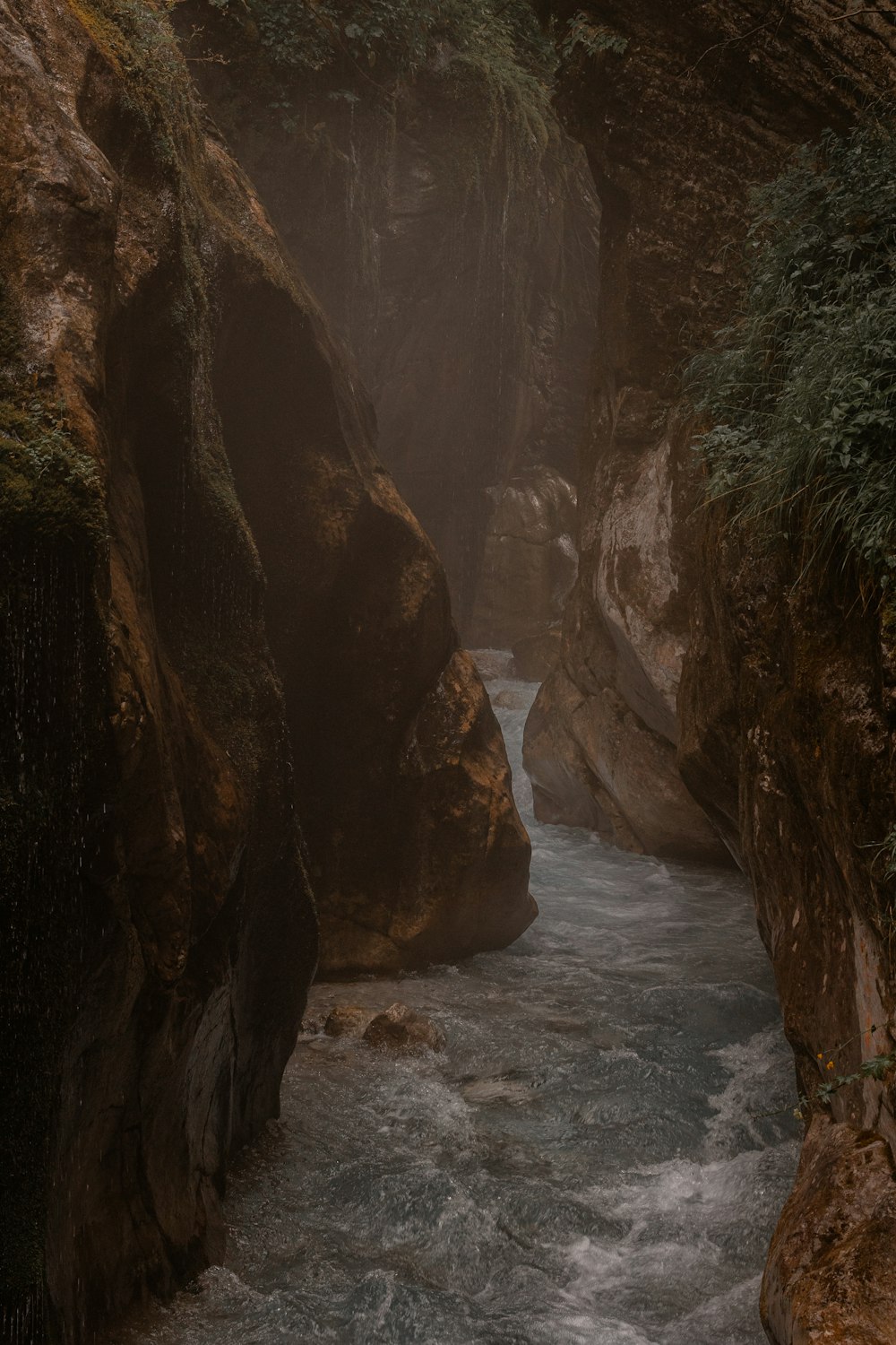 a river flowing between two large rocks