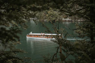 Family enjoying a boat ride on a peaceful lake in a national destination.