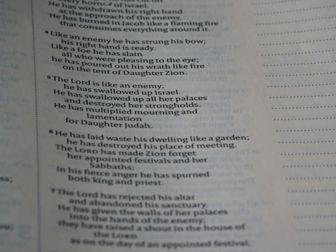 The image displays a page from a book with text in clear font. The content includes religious or biblical text, indicated by references to figures and places like the Lord and Zion. The page includes verse numbers and is formatted in a column with justified text. Dotted lines run along the edges, possibly for alignment or notes.