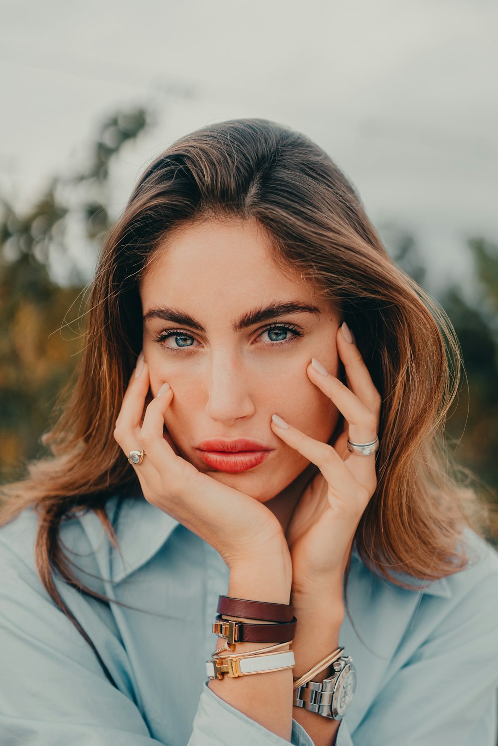 a woman with her hands on her face