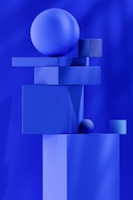 a blue abstract painting with a sphere on top of it