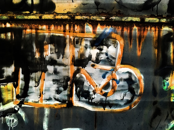 A vibrant urban artwork featuring metallic textures and electric blue strokes on a dark background.