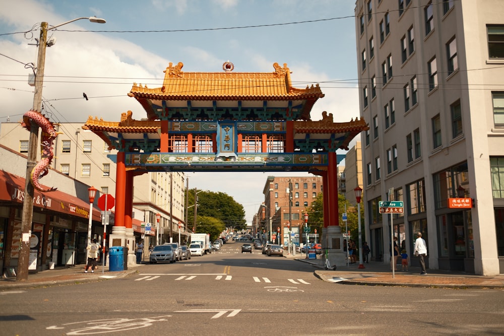 a chinese archway in the middle of a city street