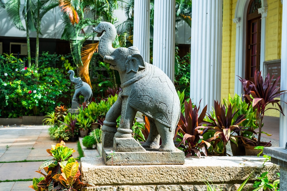 a statue of an elephant with a bird on its back