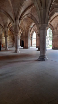 Spacious main hall with natural light streaming through tall windows.