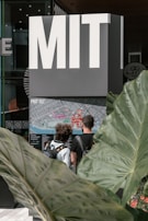 Students exploring college brochures and campus maps with enthusiasm.