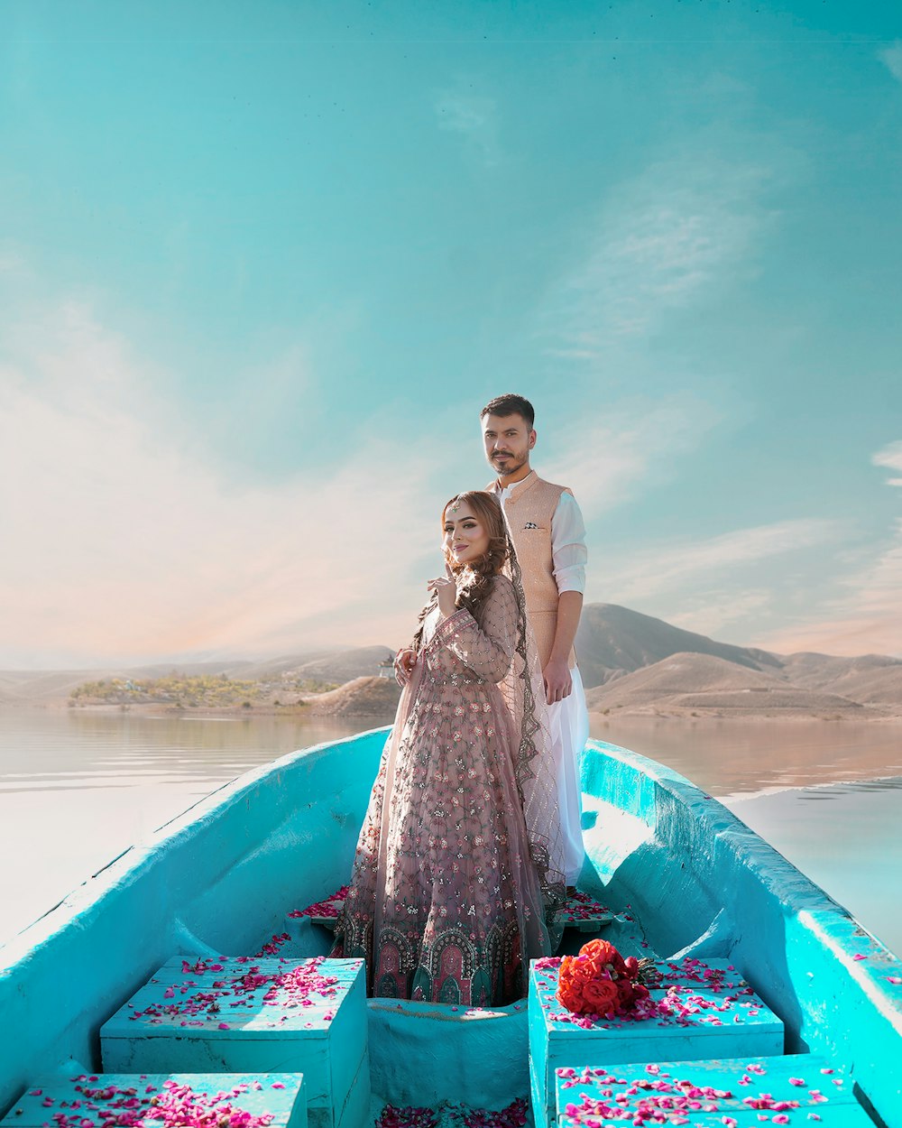 a man and a woman standing in a boat