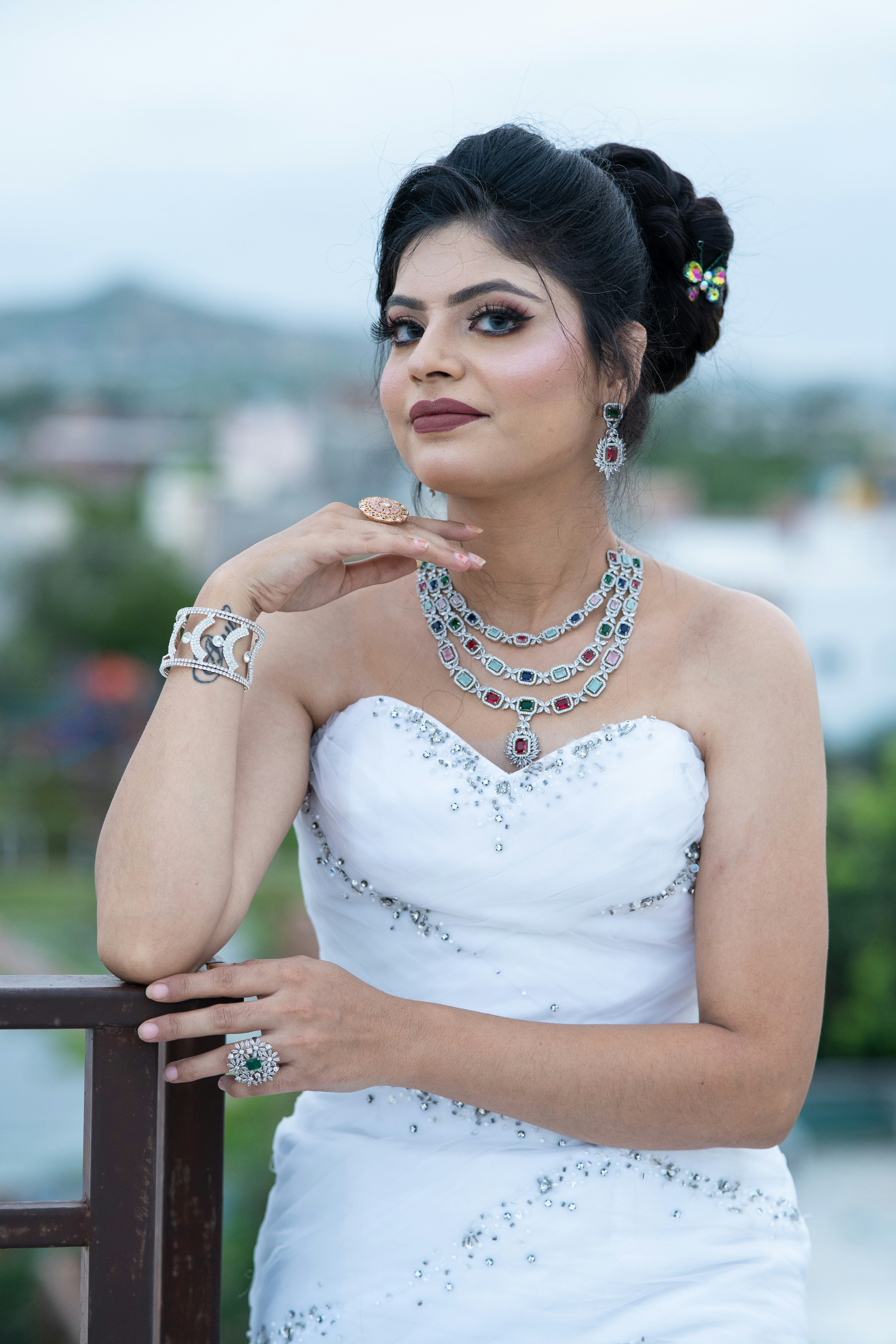 Elegant woman in white dress, sun-lit outdoor setting