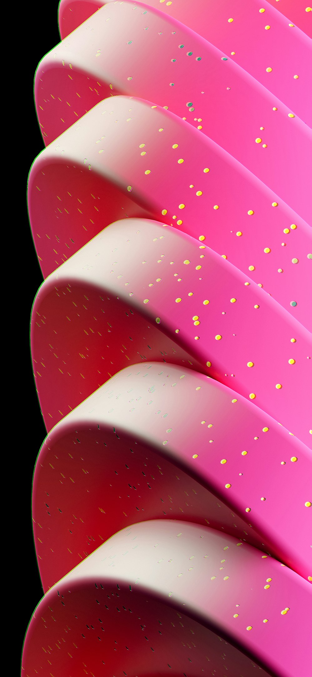 a close up of a pink surfboard with gold sprinkles