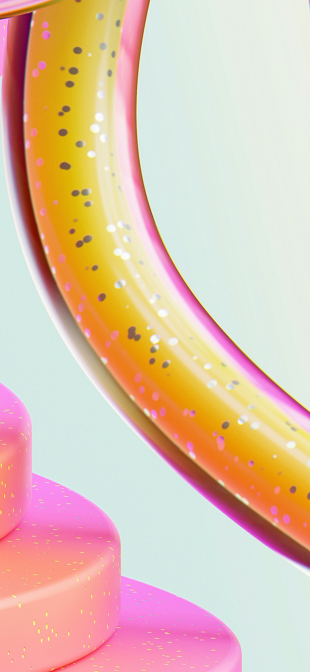 a close up of a pink and yellow object